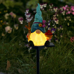 LAIAMER Solar Gnome Garden Lights, Outdoor Gnome Statue with Flowers & Apple, Solar Powered Fairy Garden Lights Gnome Decorations for Home Outside Yard Lawn Patio Gnomes Gifts (Blue)